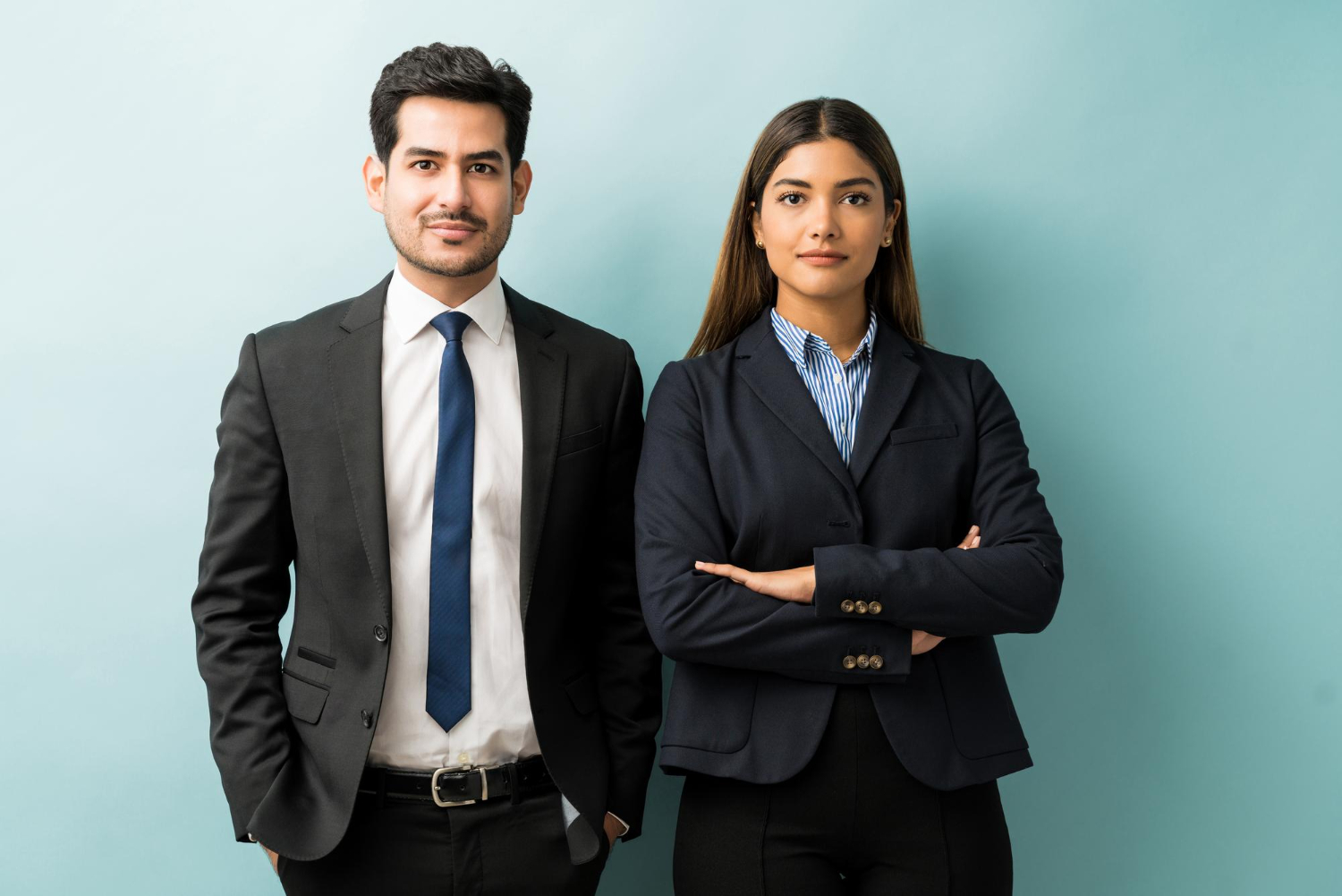 confident-hispanic-business-partners-standing-against-isolated-background